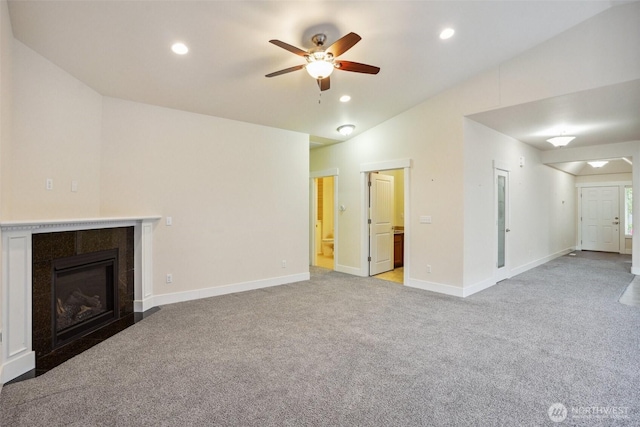 14431 22nd Avenue Ct E, Tacoma, WA 98445 - unfurnished living room with ceiling fan, a fireplace, vaulted ceiling, light carpet, and recessed lighting