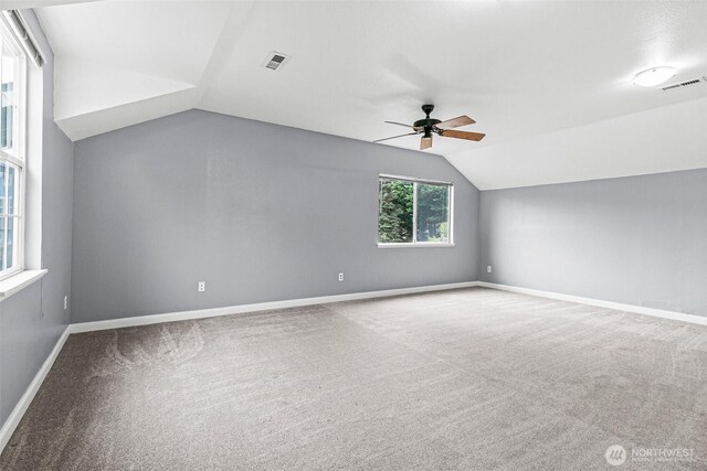 bonus room with visible vents, a ceiling fan, baseboards, carpet flooring, and vaulted ceiling