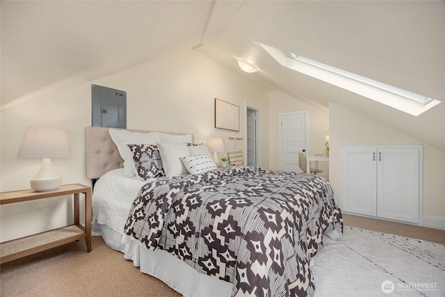 bedroom with carpet, lofted ceiling with skylight, and electric panel