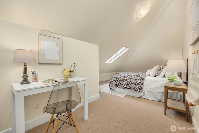 bedroom with baseboards, light carpet, and vaulted ceiling with skylight