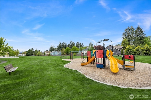 communal playground featuring a lawn