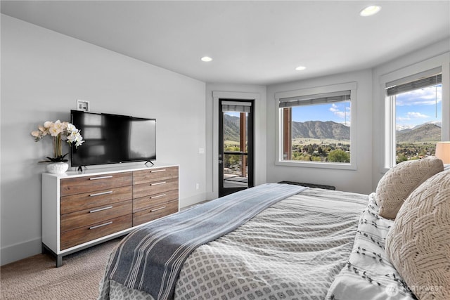 bedroom with baseboards, recessed lighting, access to exterior, and carpet