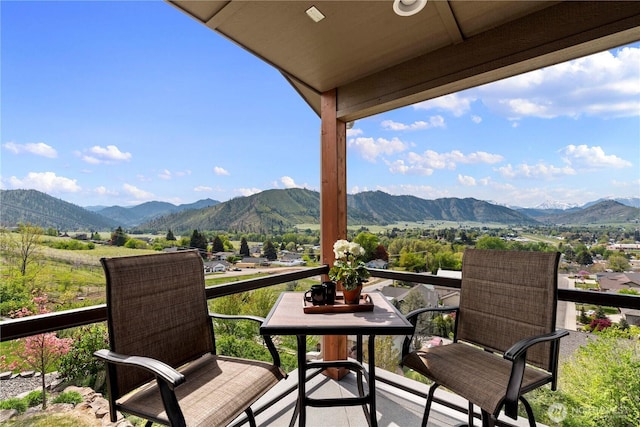 balcony featuring a mountain view