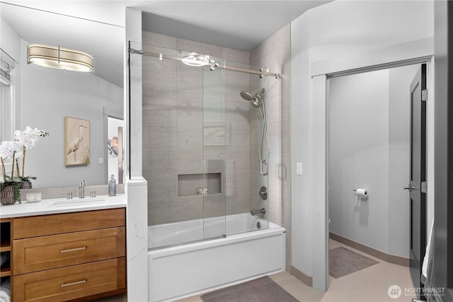 bathroom featuring enclosed tub / shower combo and vanity