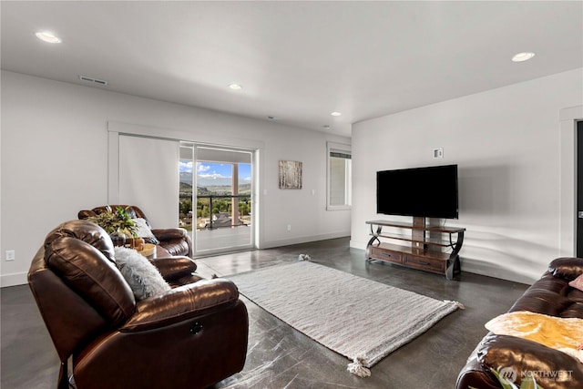 living area with baseboards, recessed lighting, and visible vents
