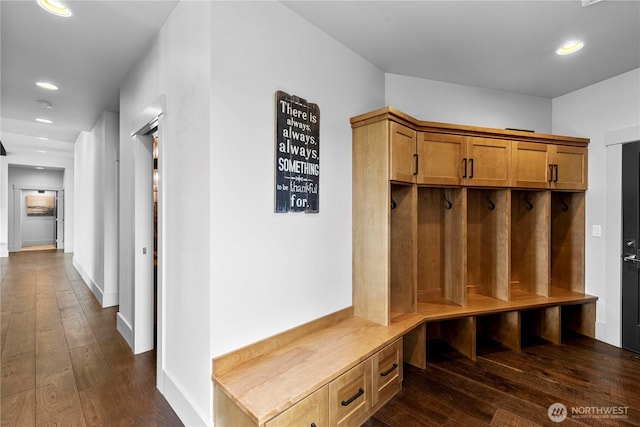 mudroom with recessed lighting, dark wood finished floors, and baseboards
