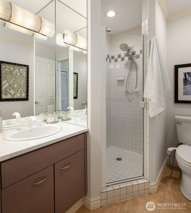 bathroom featuring crown molding, tile patterned floors, a stall shower, and toilet