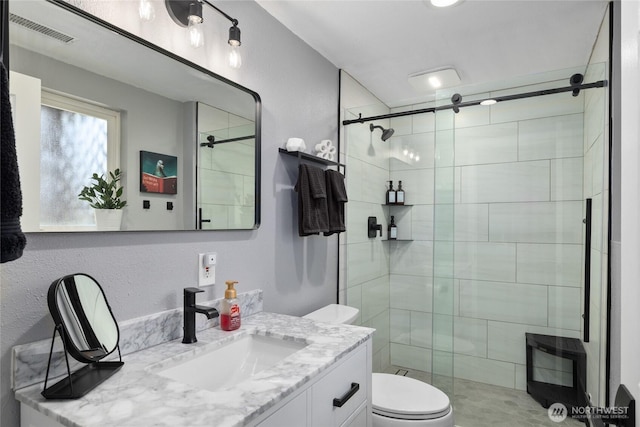 full bathroom featuring visible vents, vanity, heating unit, toilet, and a shower stall