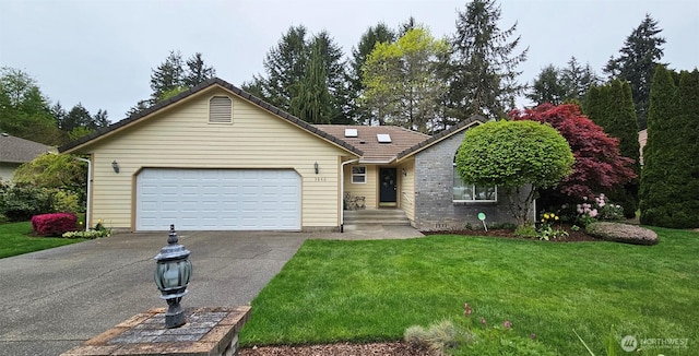 view of front facade with a garage, a tiled roof, driveway, and a front yard