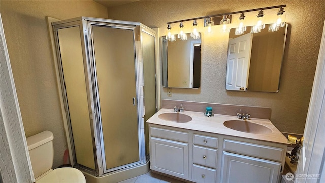3840 Cortez Loop SW, Tumwater, WA 98512 - full bath with a stall shower, double vanity, and a textured wall