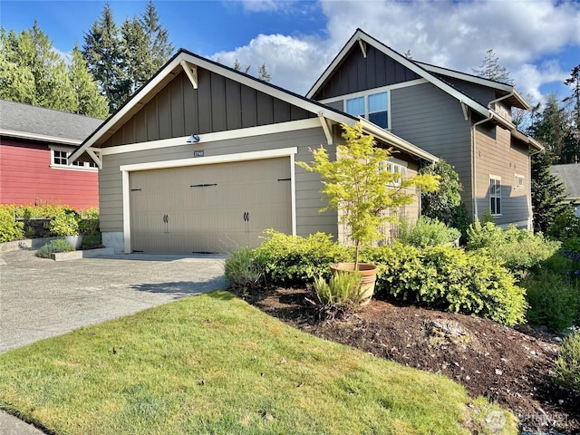 1740 NE Nutkana Way, Poulsbo, WA 98370 - craftsman-style house featuring board and batten siding, concrete driveway, a garage, and a front lawn