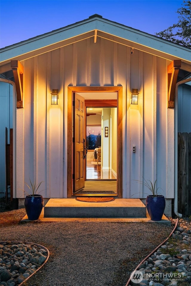 doorway to property featuring board and batten siding