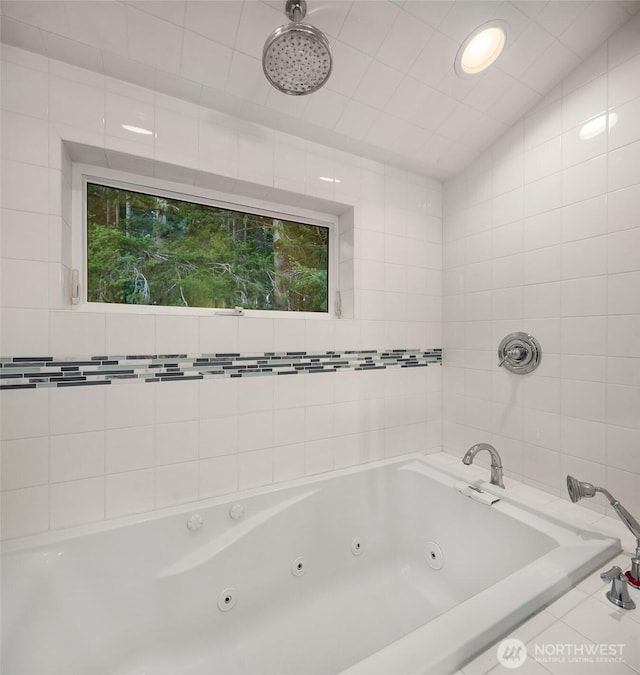 full bathroom with tiled shower and a jetted tub