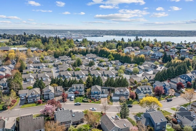aerial view featuring a water view and a residential view