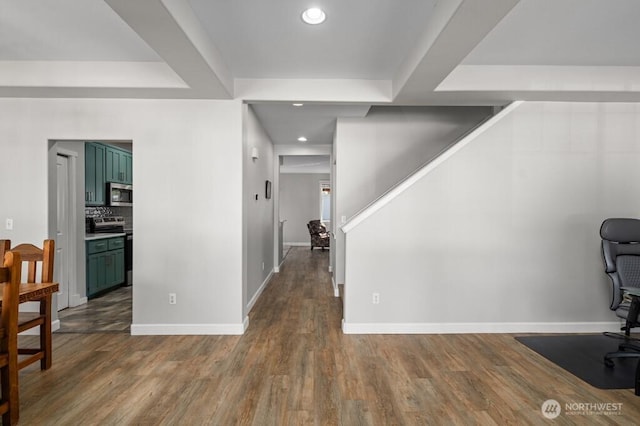 interior space with stairs, wood finished floors, baseboards, and recessed lighting