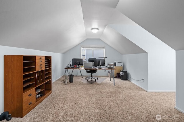 office with lofted ceiling, carpet, and baseboards