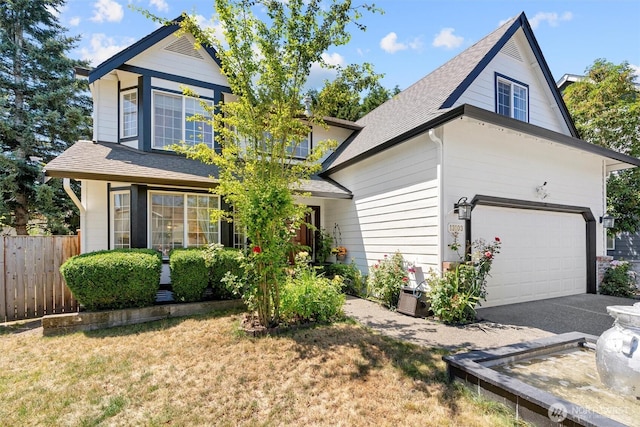 13103 SE 261st Pl, Kent, WA 98030 - view of front facade featuring a garage, roof with shingles, fence, and a front yard