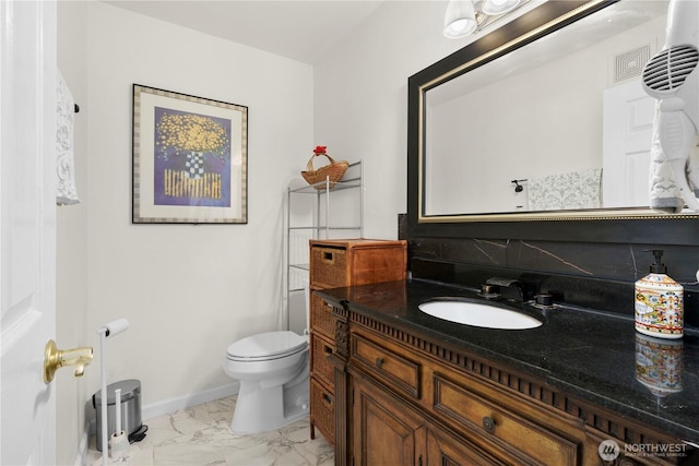 13103 SE 261st Pl, Kent, WA 98030 - half bath featuring vanity, marble finish floor, baseboards, and toilet