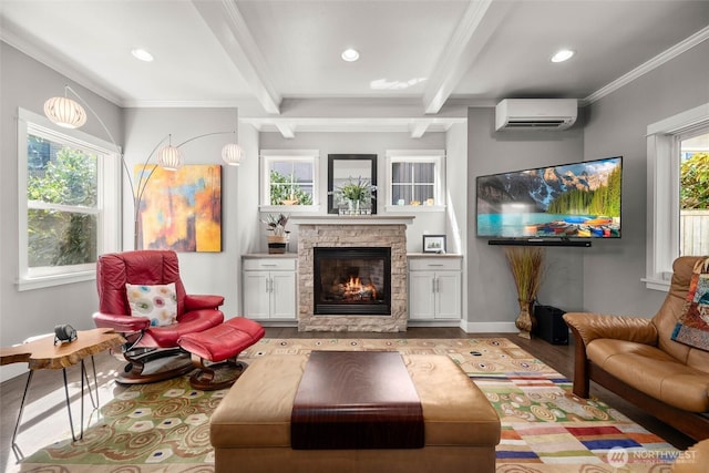 interior space featuring wood finished floors, baseboards, a wall unit AC, and beam ceiling