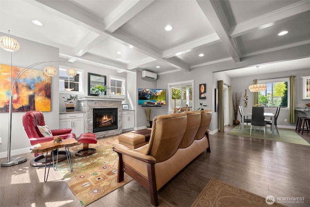 living room featuring baseboards, coffered ceiling, a wall mounted AC, and beam ceiling