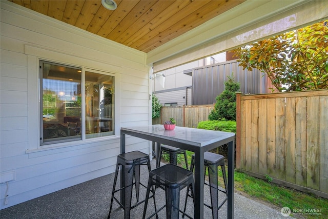 view of patio / terrace featuring outdoor dining area and fence