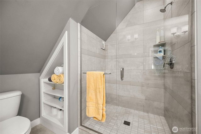 full bath with vaulted ceiling, toilet, and a shower stall