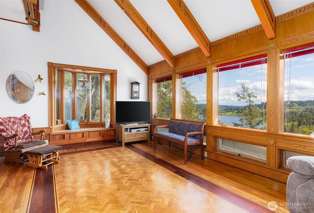 4385 Wildwood Ln, Anacortes, WA 98221 - living room featuring high vaulted ceiling, beam ceiling, plenty of natural light, and wooden walls