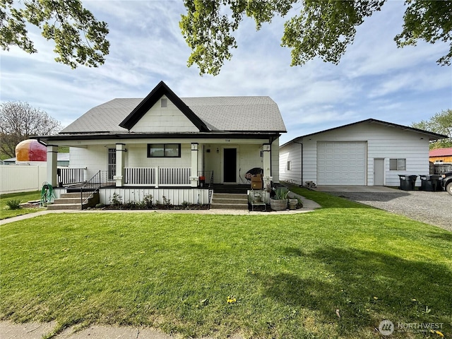 711 E Dayton Ave, Dayton, WA 99328 - view of front of home featuring a front lawn, a garage, an outbuilding, covered porch, and driveway
