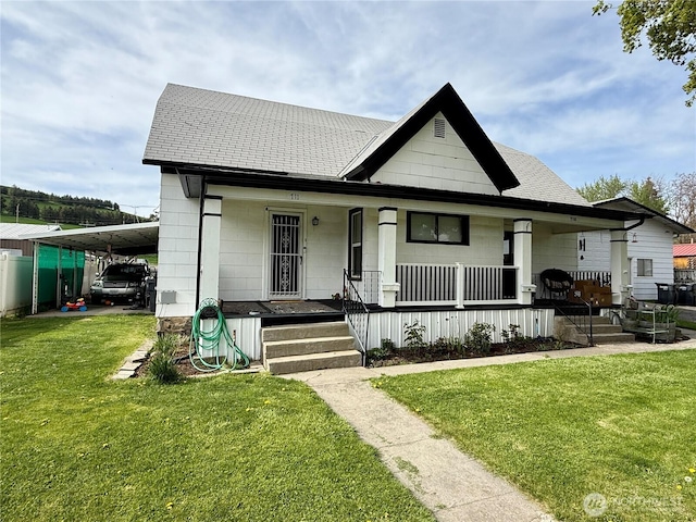 711 E Dayton Ave, Dayton, WA 99328 - bungalow-style house with a porch, a front yard, and a shingled roof