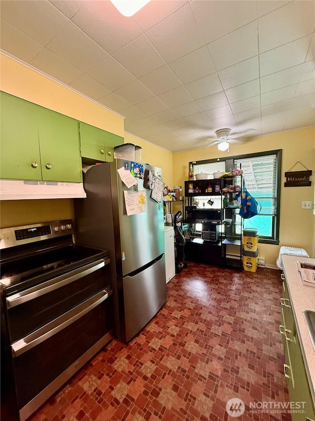 711 E Dayton Ave, Dayton, WA 99328 - kitchen featuring green cabinetry, appliances with stainless steel finishes, under cabinet range hood, a ceiling fan, and brick floor