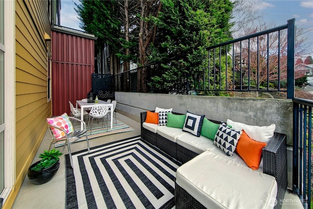 view of patio / terrace with outdoor lounge area and fence
