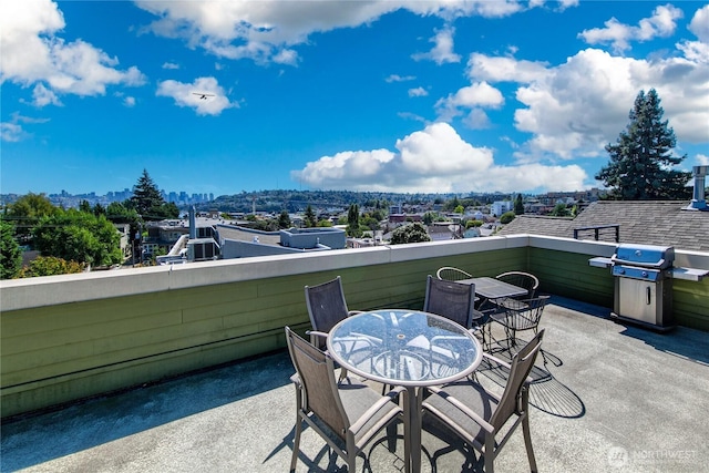 view of patio / terrace with outdoor dining space, a balcony, and a grill