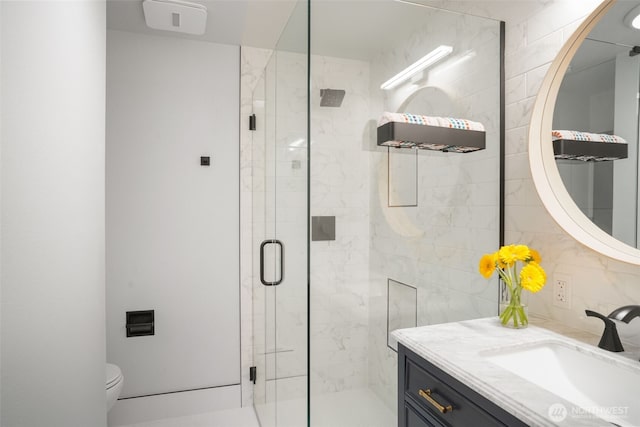 8305 NW Fruit Valley Rd, Vancouver, WA 98665 - bathroom featuring toilet, vanity, and a shower stall