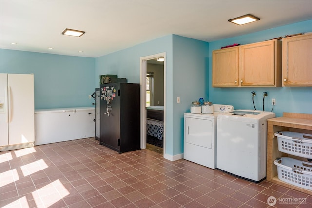 486 Wren Rd, Lopez Island, WA 98261 - washroom featuring tile patterned flooring, recessed lighting, separate washer and dryer, and cabinet space