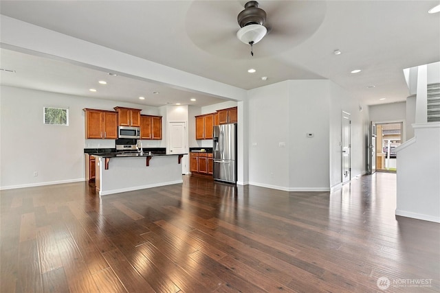 4000 Cameron Dr NE, Lacey, WA 98516 - unfurnished living room featuring a ceiling fan, recessed lighting, healthy amount of natural light, and dark wood finished floors