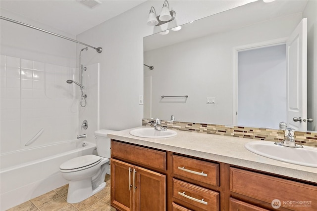 4000 Cameron Dr NE, Lacey, WA 98516 - full bathroom featuring double vanity, tub / shower combination, tile patterned flooring, and backsplash