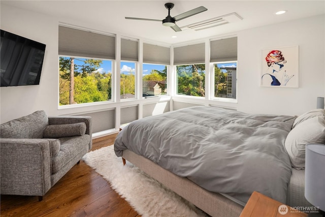 bedroom featuring wood finished floors, recessed lighting, visible vents, and a ceiling fan