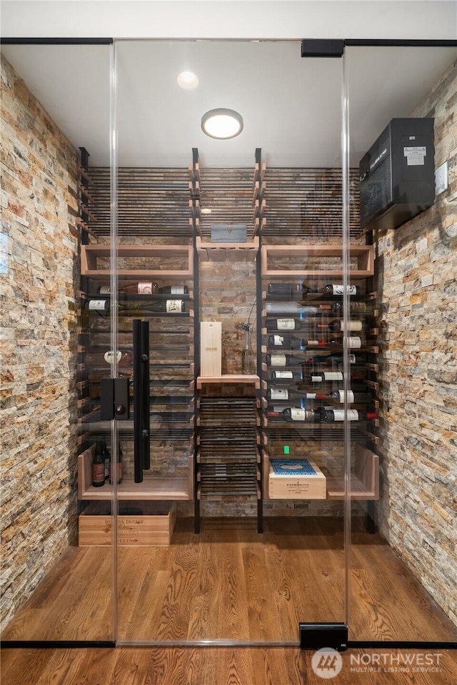 wine area featuring wood finished floors
