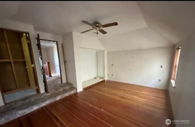additional living space with lofted ceiling, ceiling fan, and wood finished floors