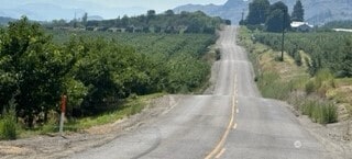 view of street featuring a rural view