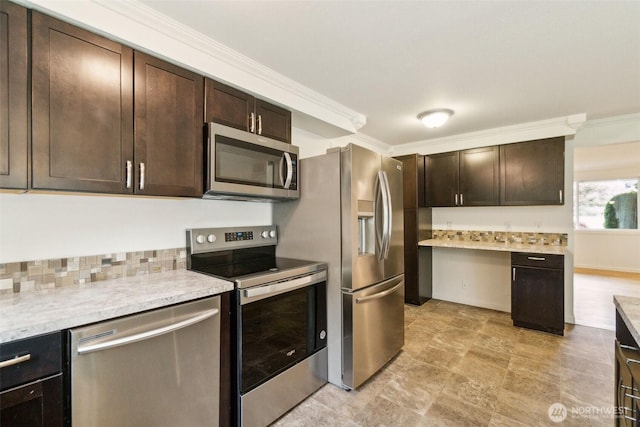 kitchen with light countertops, appliances with stainless steel finishes, ornamental molding, and dark brown cabinets
