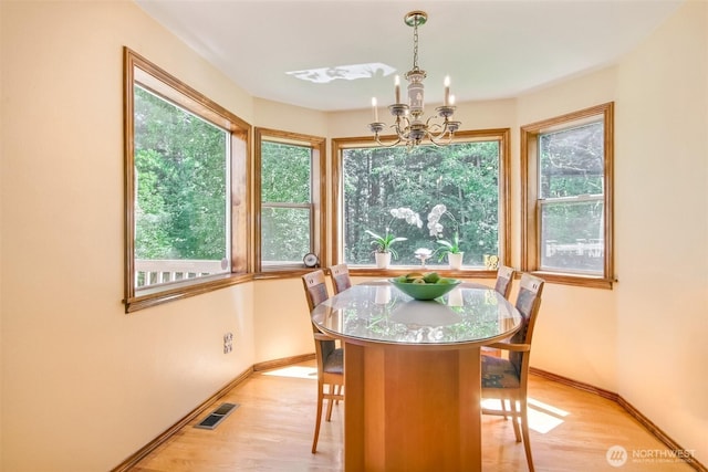 209 SW 331st Pl, Federal Way, WA 98023 - dining space featuring a chandelier and light wood-style floors