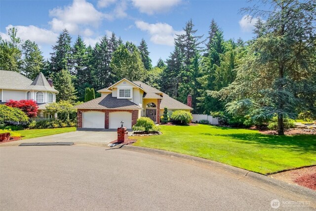 209 SW 331st Pl, Federal Way, WA 98023 - view of front facade with concrete driveway, a shingled roof, and brick siding
