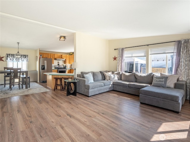 105 3rd St SW, Rock Island, WA 98850 - living area featuring an inviting chandelier and wood finished floors