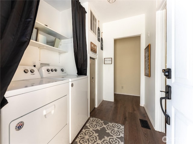 105 3rd St SW, Rock Island, WA 98850 - laundry area with laundry area, dark wood finished floors, baseboards, visible vents, and washer and clothes dryer