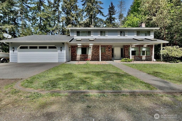 70 Shadow Trl, Sequim, WA 98382 - view of front of house with a chimney, driveway, brick siding, a garage, and a front lawn