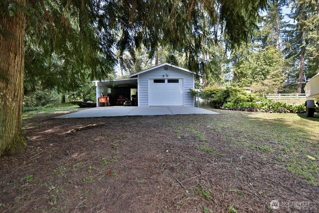 70 Shadow Trl, Sequim, WA 98382 - garage with fence, a detached garage, and driveway