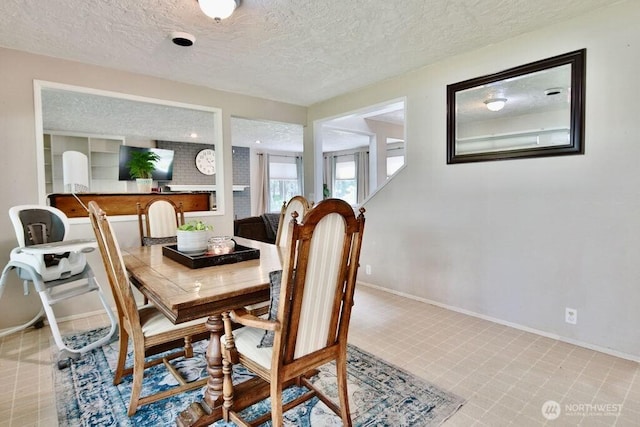 70 Shadow Trl, Sequim, WA 98382 - dining area featuring a textured ceiling and baseboards
