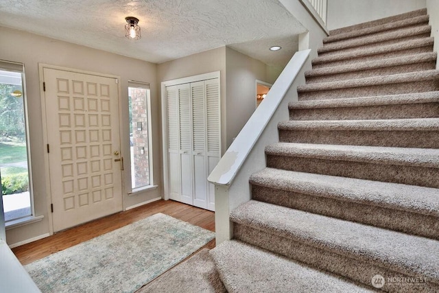 70 Shadow Trl, Sequim, WA 98382 - foyer entrance featuring stairs, a wealth of natural light, and wood finished floors