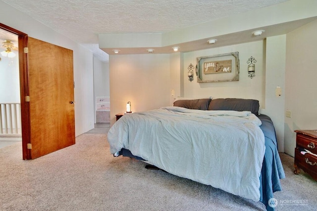 70 Shadow Trl, Sequim, WA 98382 - carpeted bedroom featuring a textured ceiling and connected bathroom